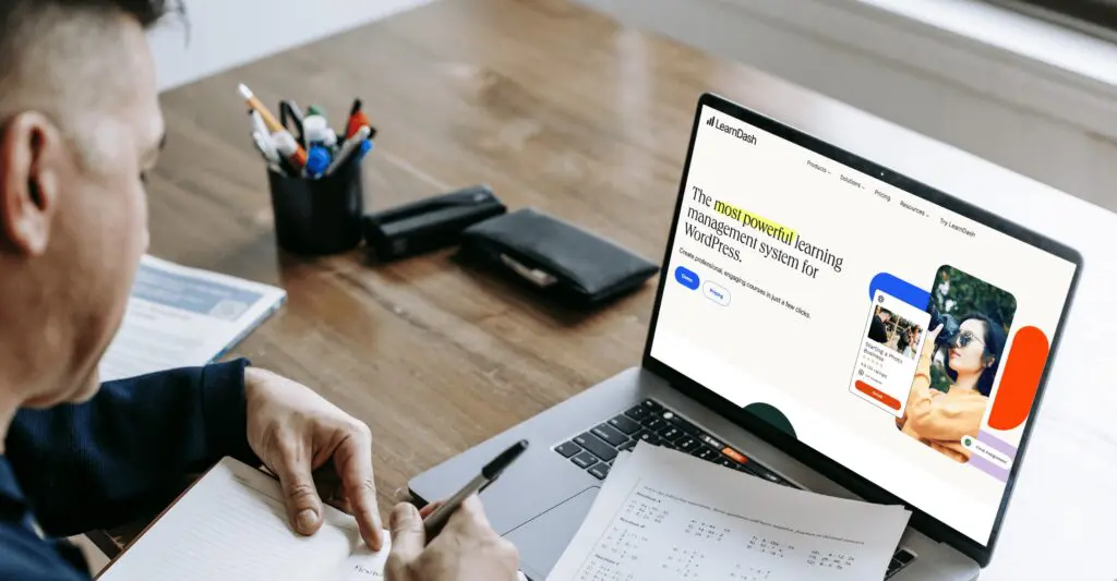 A man taking notes from Learndash website